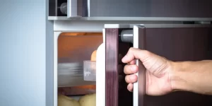 hand opening fridge